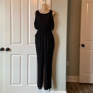 Comfortable black jumpsuit. See through on the top.